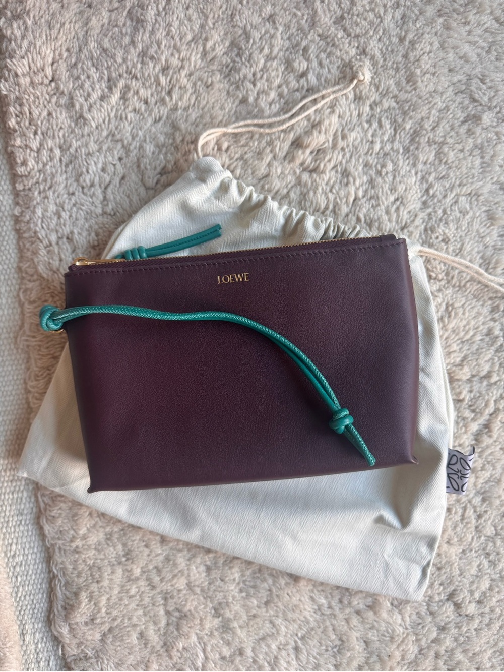 Loewe Plum Leather Wrist Pouch with Teal Cord Accent